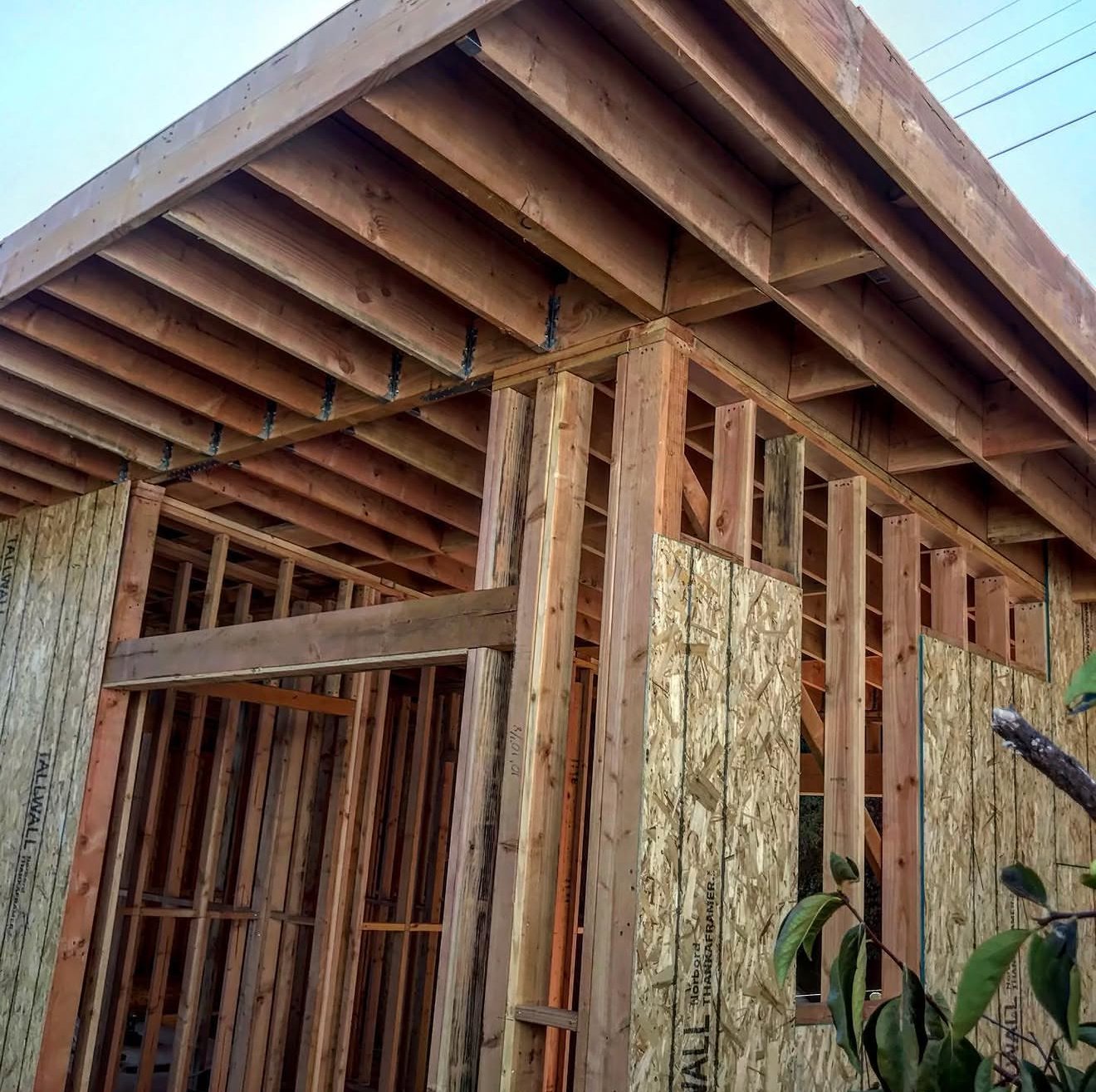 Exposed rafter tails and deep eaves on a framed addition